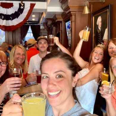 a group of people holding wine glasses