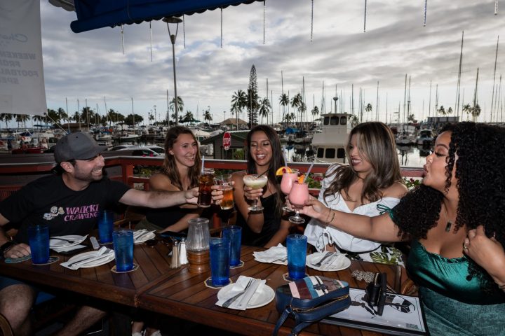 Marsha Thomason et al. sitting at a table posing for the camera